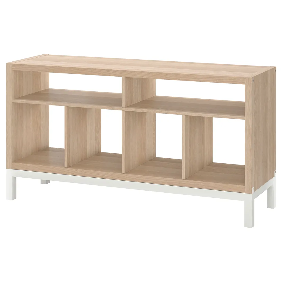 Is of a light brown wooden KALLAX tv bench with open compartments and a metal underframe, set against a white background.