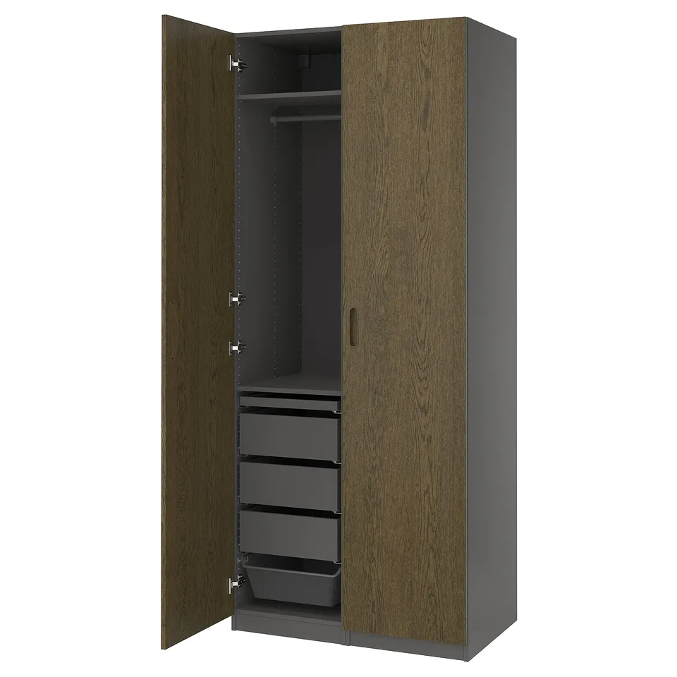 A PAX wardrobe, a classic closet with wooden doors and multiple drawers. Its designed for organising clothes efficiently.