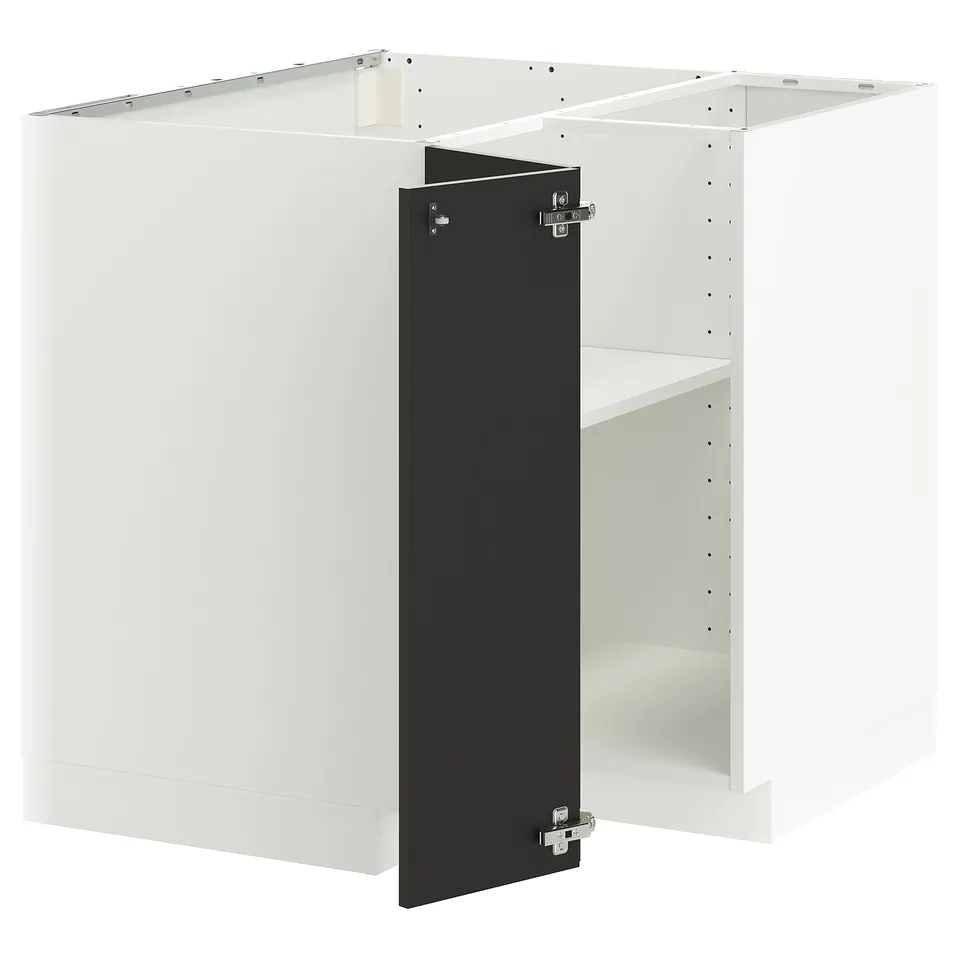 A white and black METOD kitchen cabinet with a single shelf and adjustable hinges.