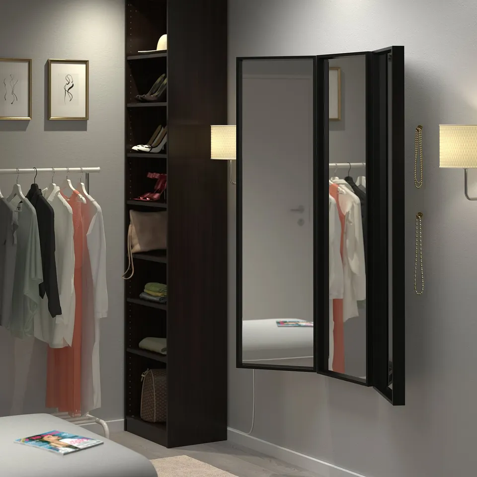 NISSEDAL trinity mirror set in black, large, floor-to-ceiling, reflecting bedrooms wardrobe and bed, with dark frame, modern design.