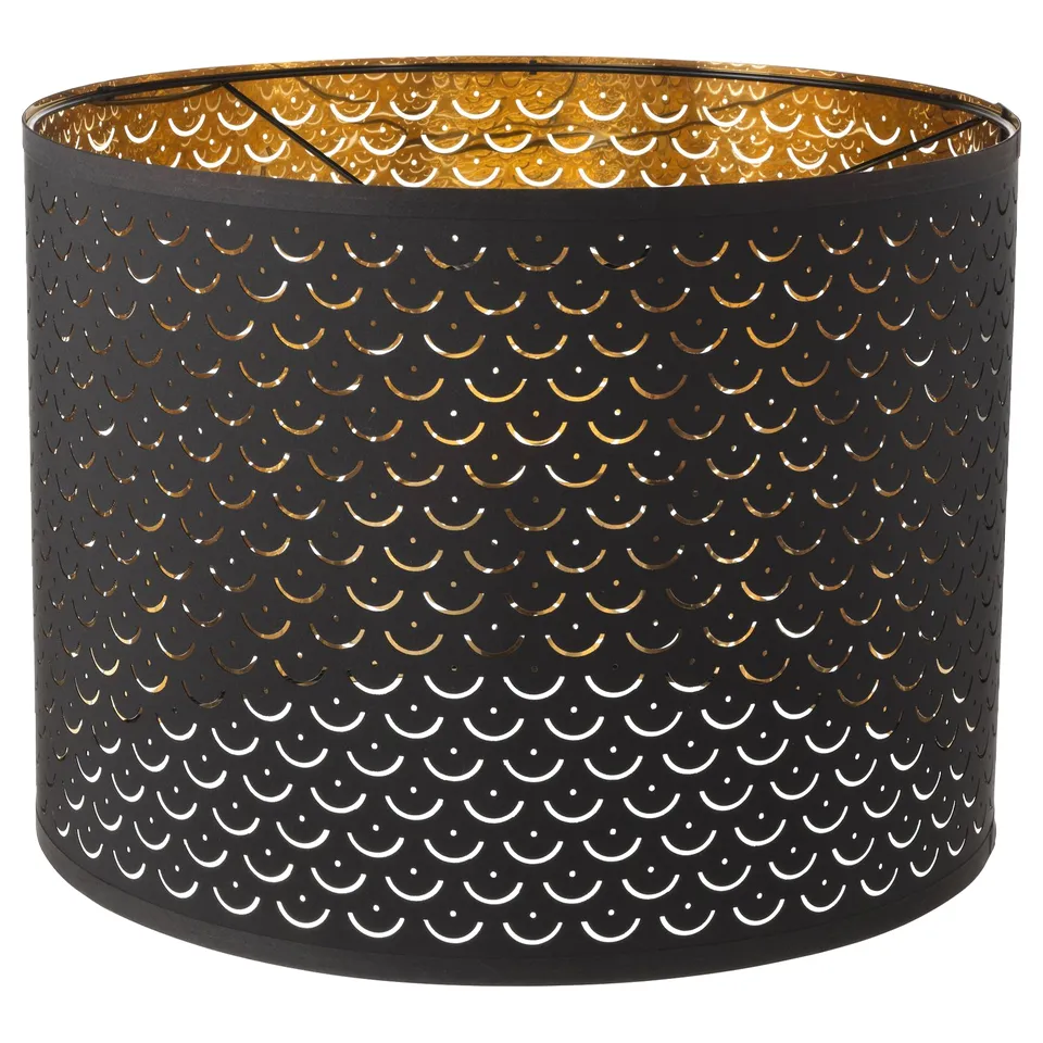 NYMÖ black & gold patterned lampshade, cylindrical shape, perforated design with gleaming dots.