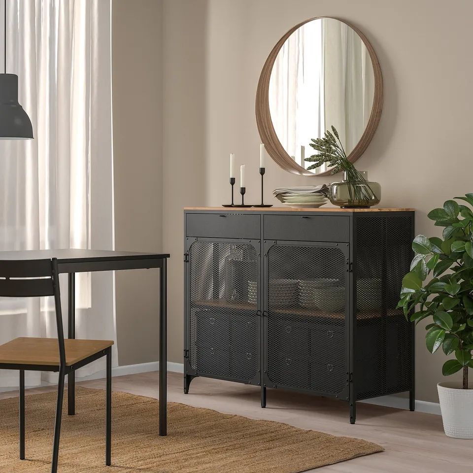 FJÄLLBO sideboard, black, metal & wood, rectangular, industrial design. Held below a large round mirror.