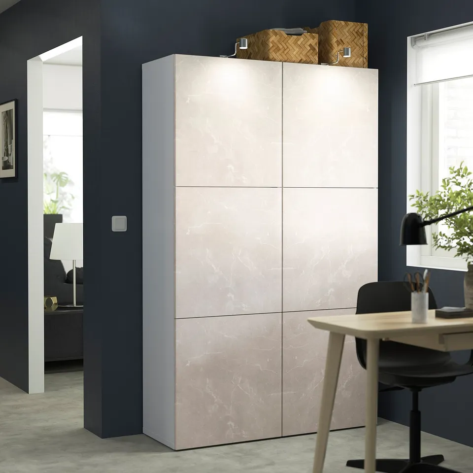 BESTÅ cream cabinet by desk.