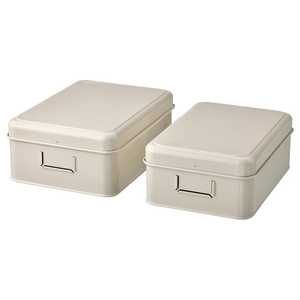 Two cream-colored rectangular metal boxes with lids and handles, designed for storing papers and accessories.