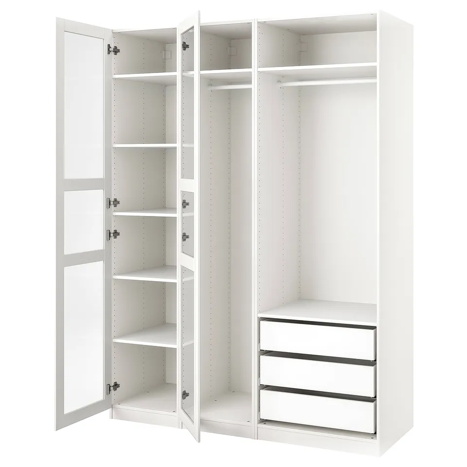 White PAX wardrobe with open doors showing shelves and drawer unit.