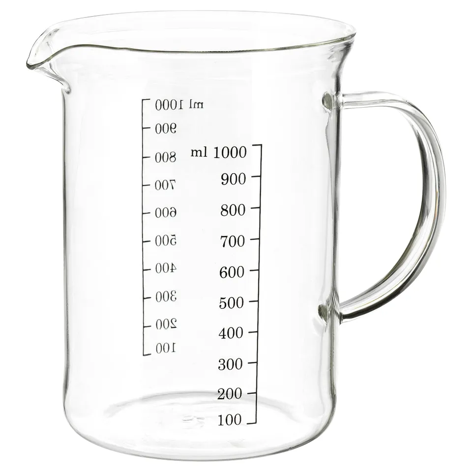 Clear glass measuring jug with handle and markings for measuring liquids.