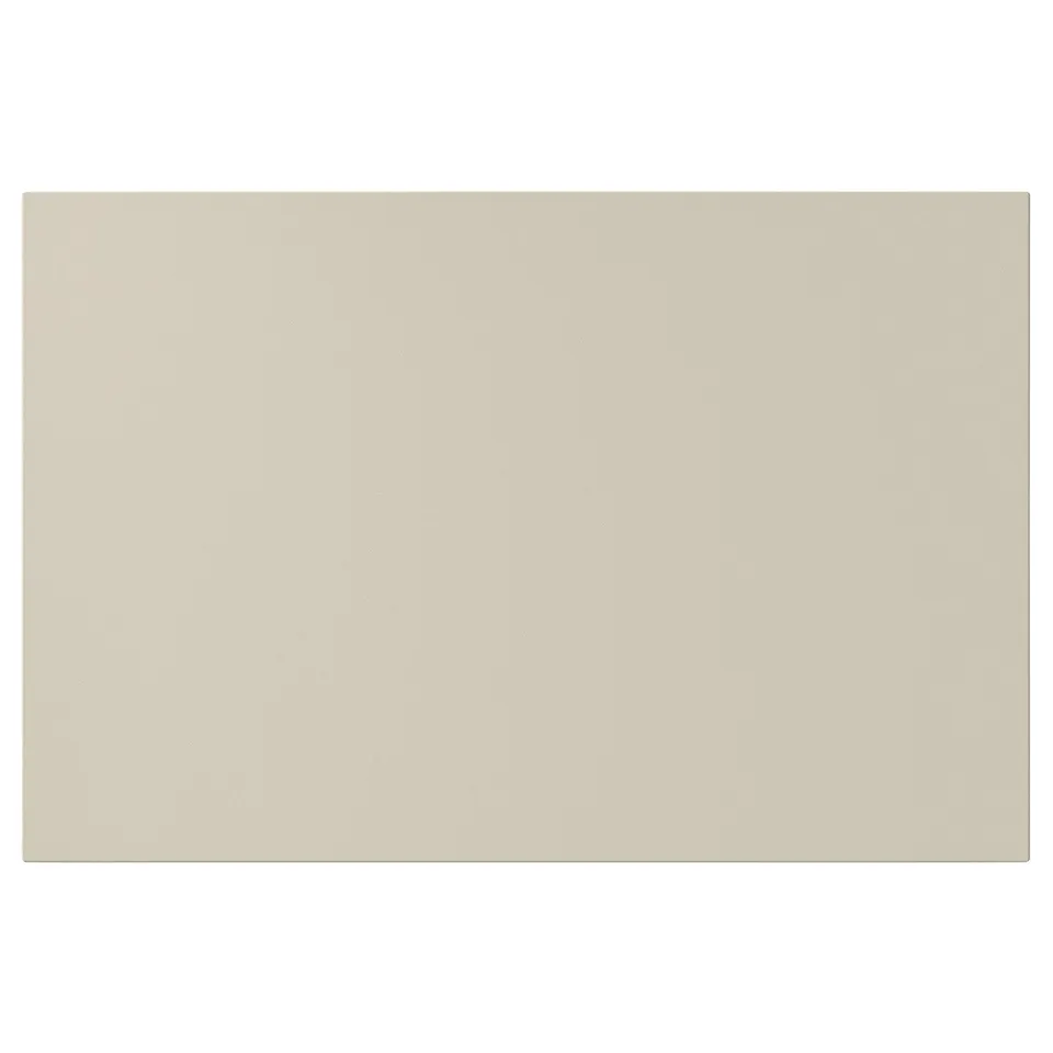 A beige HAVSTORP cabinet door. Its rectangular, smooth, and has clean lines, perfect for a modern kitchen. Made from acrylic paint and fibreboard.