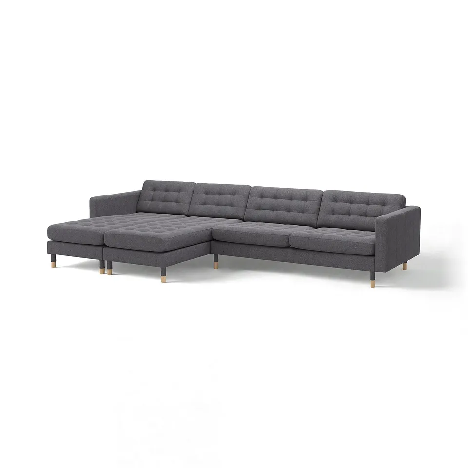 Large grey sectional sofa with tufted back and seating, featuring a chaise lounge and wooden legs.