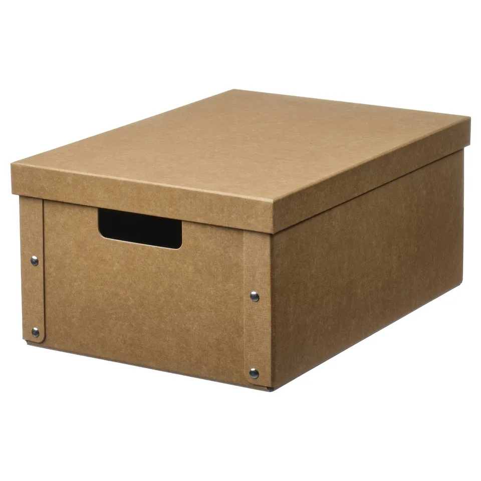 A brown GÄRDESGÅRD storage box. Its rectangular with a lid, made from 100% recycled paper and paperboard, and two metal fasteners and a handle.