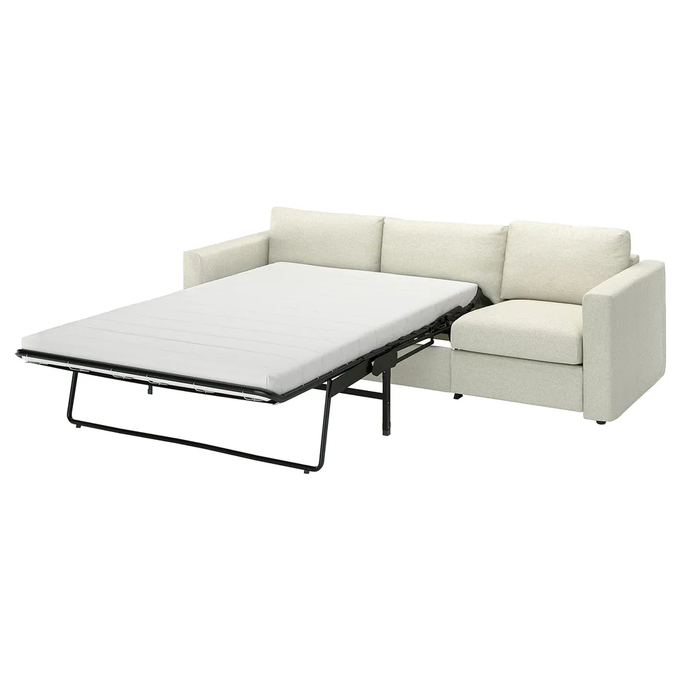 A beige VIMLE convertible sofa-bed with a thick mattress and metal frame.