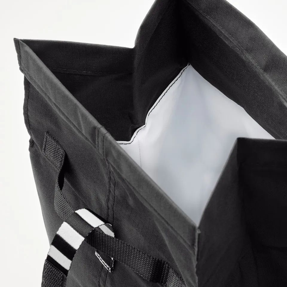 Black insulated lunch bag with sturdy handles and inner pocket, designed for durability and style.