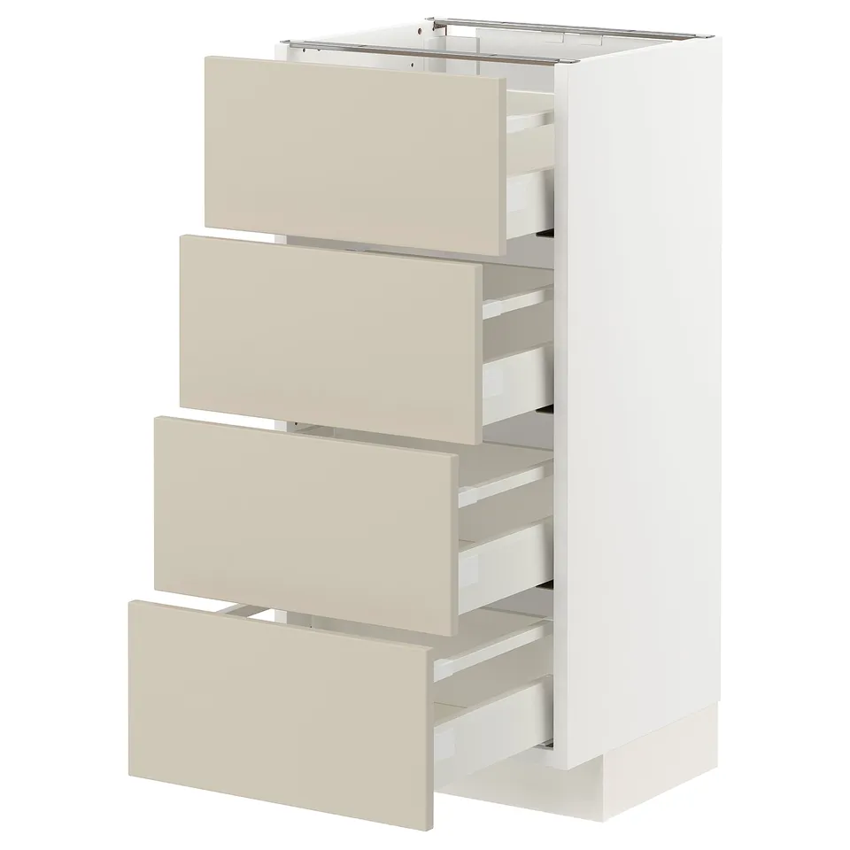 A white METOD kitchen unit with beige drawers and a sleek, modern design.