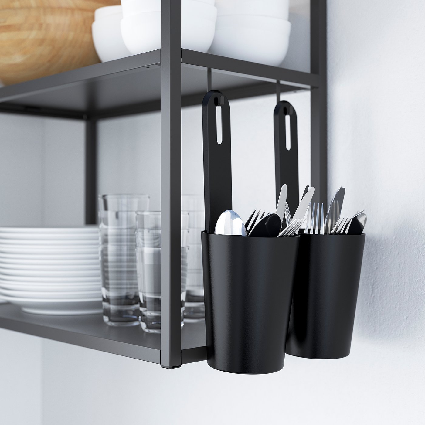 Black kitchen organiser with hanging containers holding utensils and cups. Shelves store plates and glasses neatly.