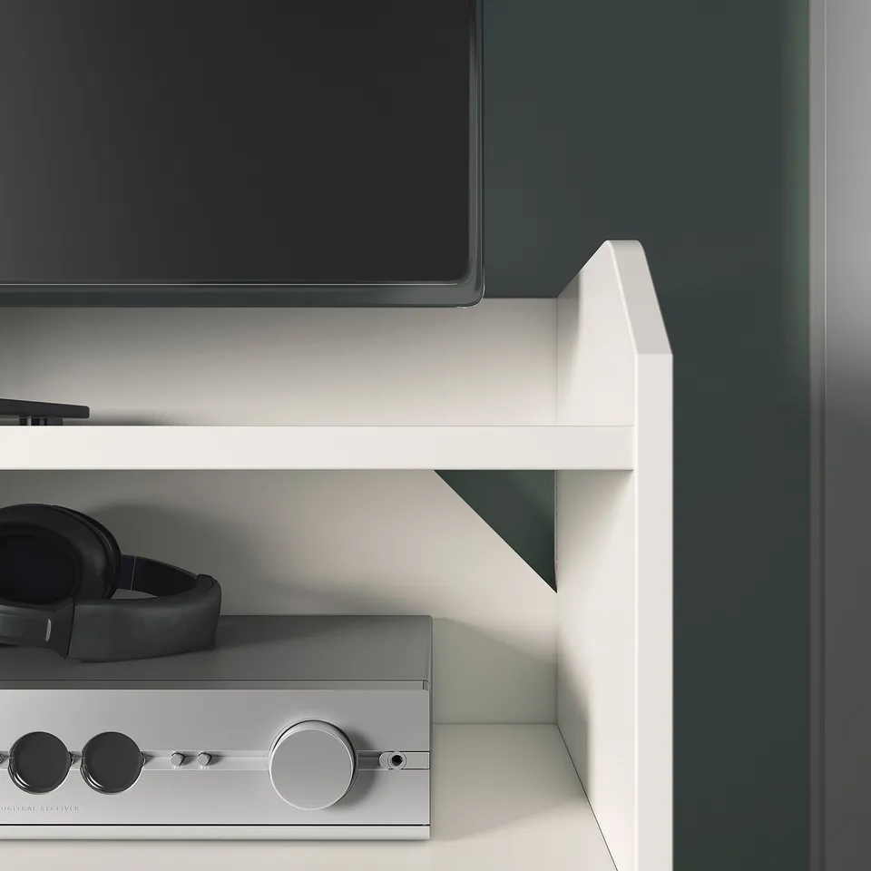 Modern tv unit with three drawers and cable management system. White finish and room for media devices, offering a tidy and organised setup.