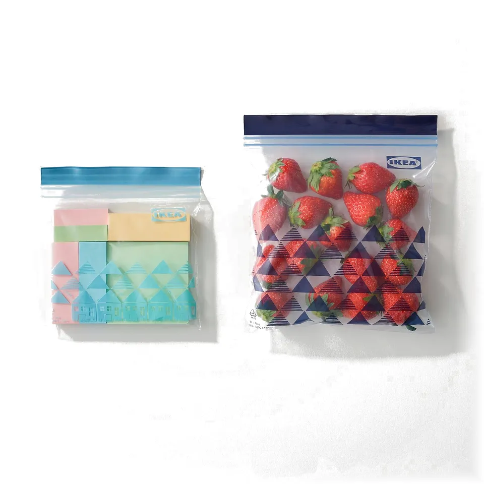 Two resealable IKEA bags shown. Left bag holds colourful blocks, right bag filled with strawberries. Both transparent.