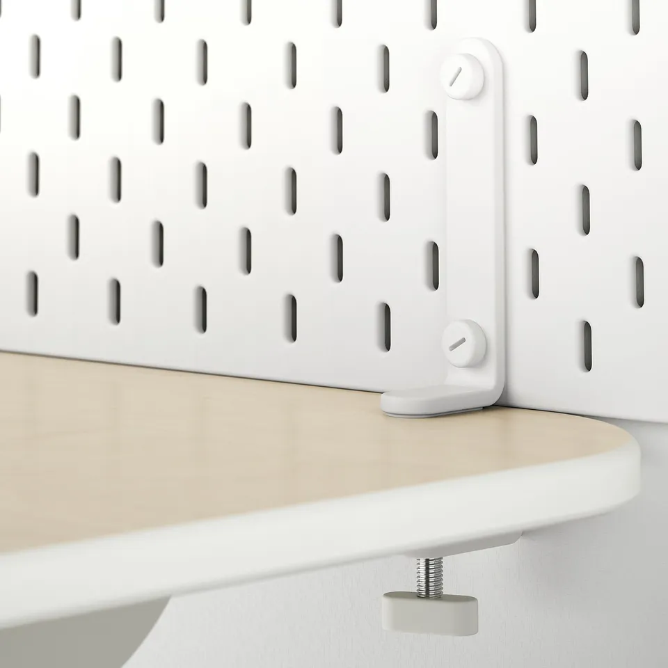 White wall-mountable pegboard connectors holding a wooden shelf. No wall drilling needed.