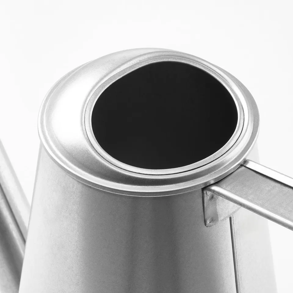 Silver watering can, high quality, rust-resistant steel. Wide handle, built for comfort.