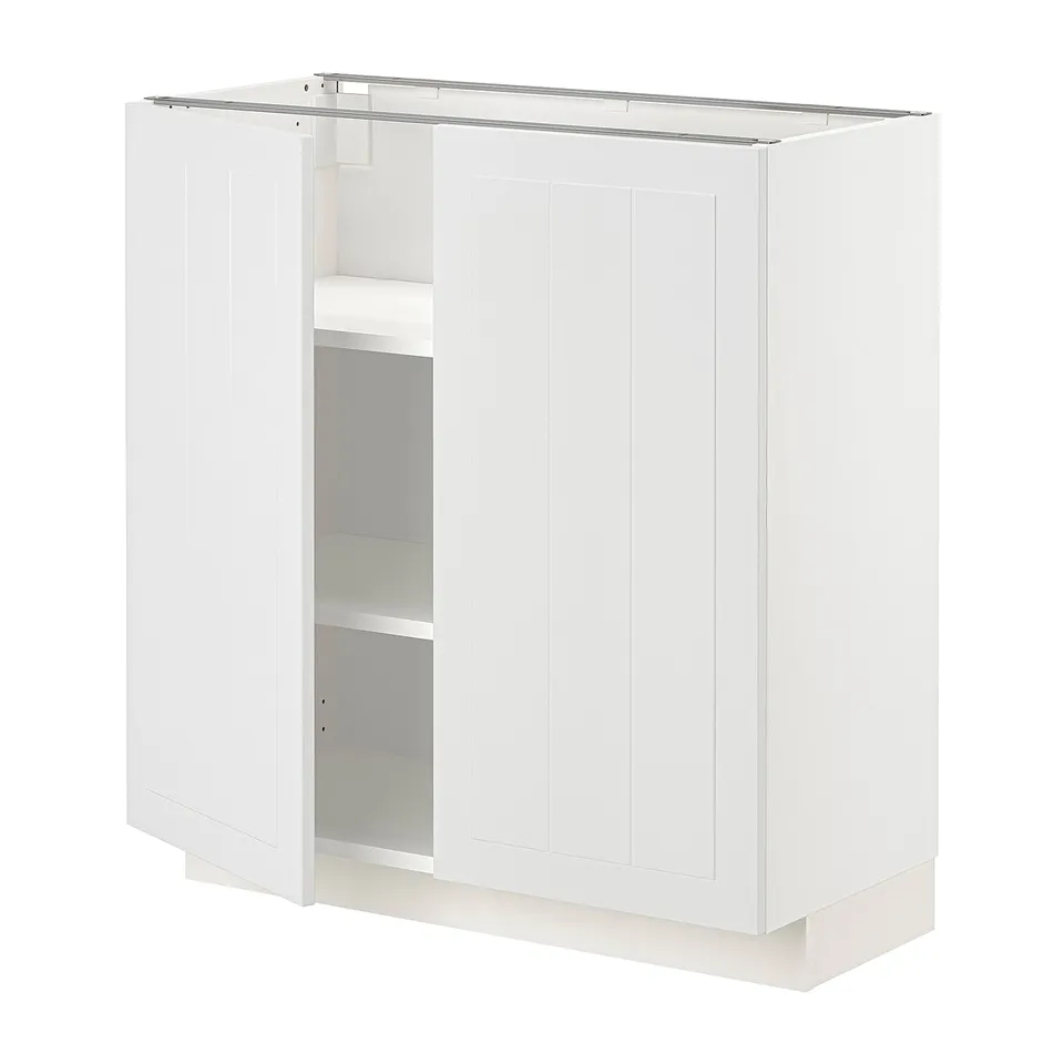 A white METOD kitchen cabinet with two doors and adjustable shelves.