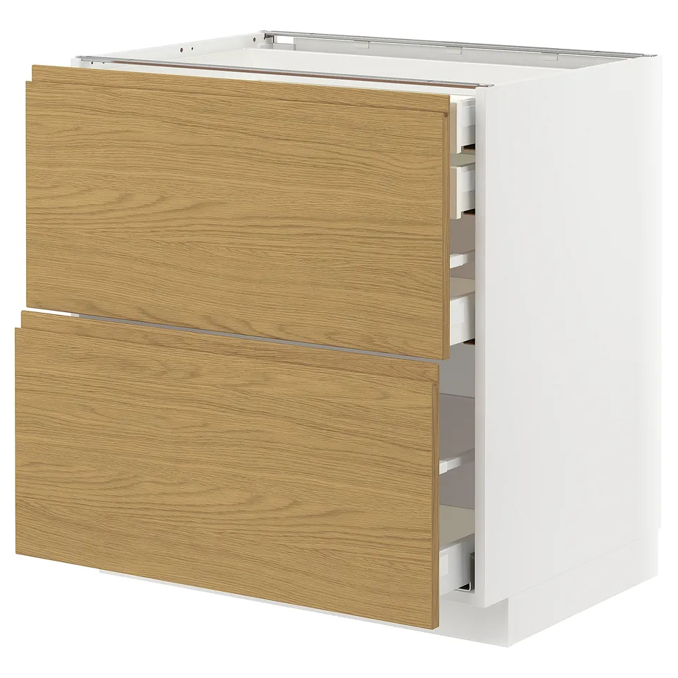 A white METOD kitchen cabinet with two oak-colored wooden drawers, featuring a modern design.