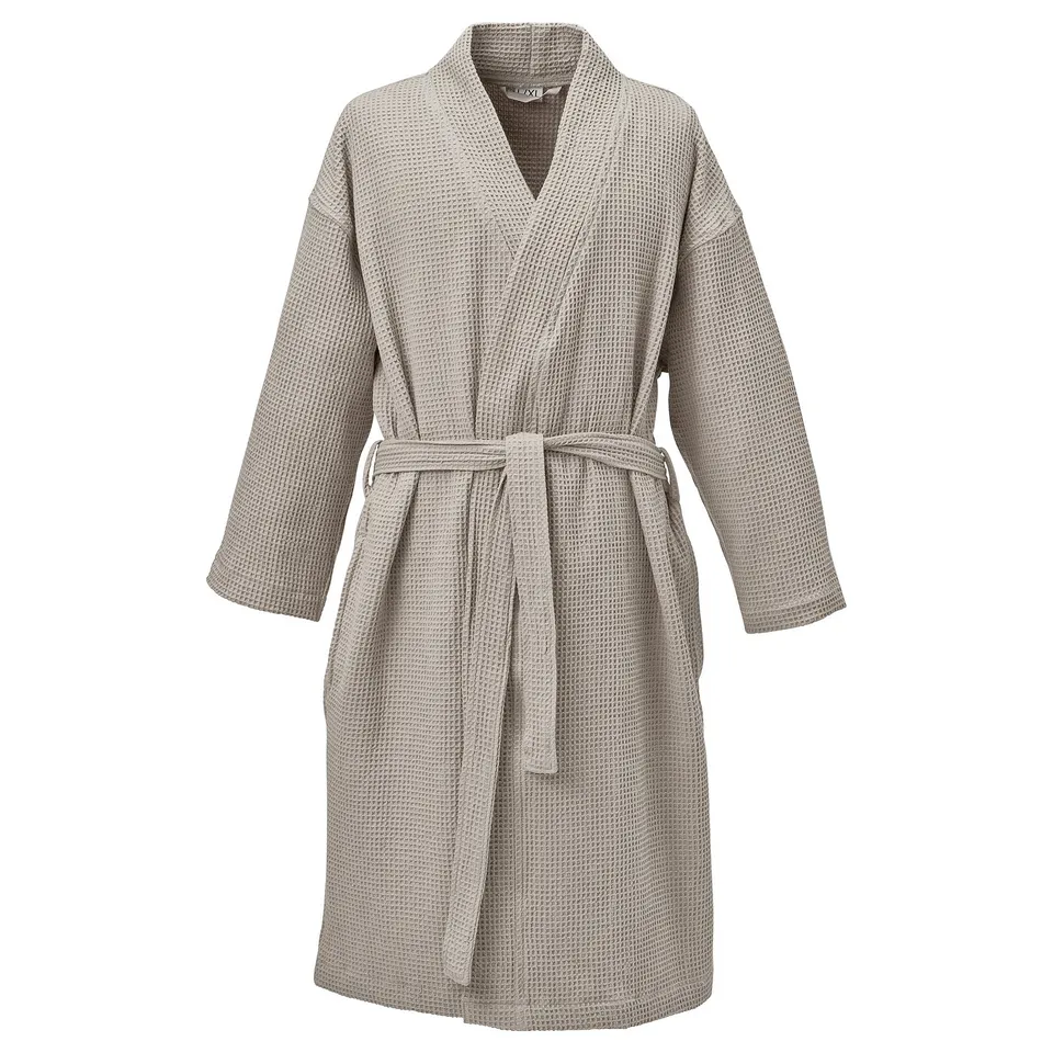 Grey GULDLÖNN robe, made of 50% recycled cotton, featuring a waffle texture, belted front, and full-length sleeves.