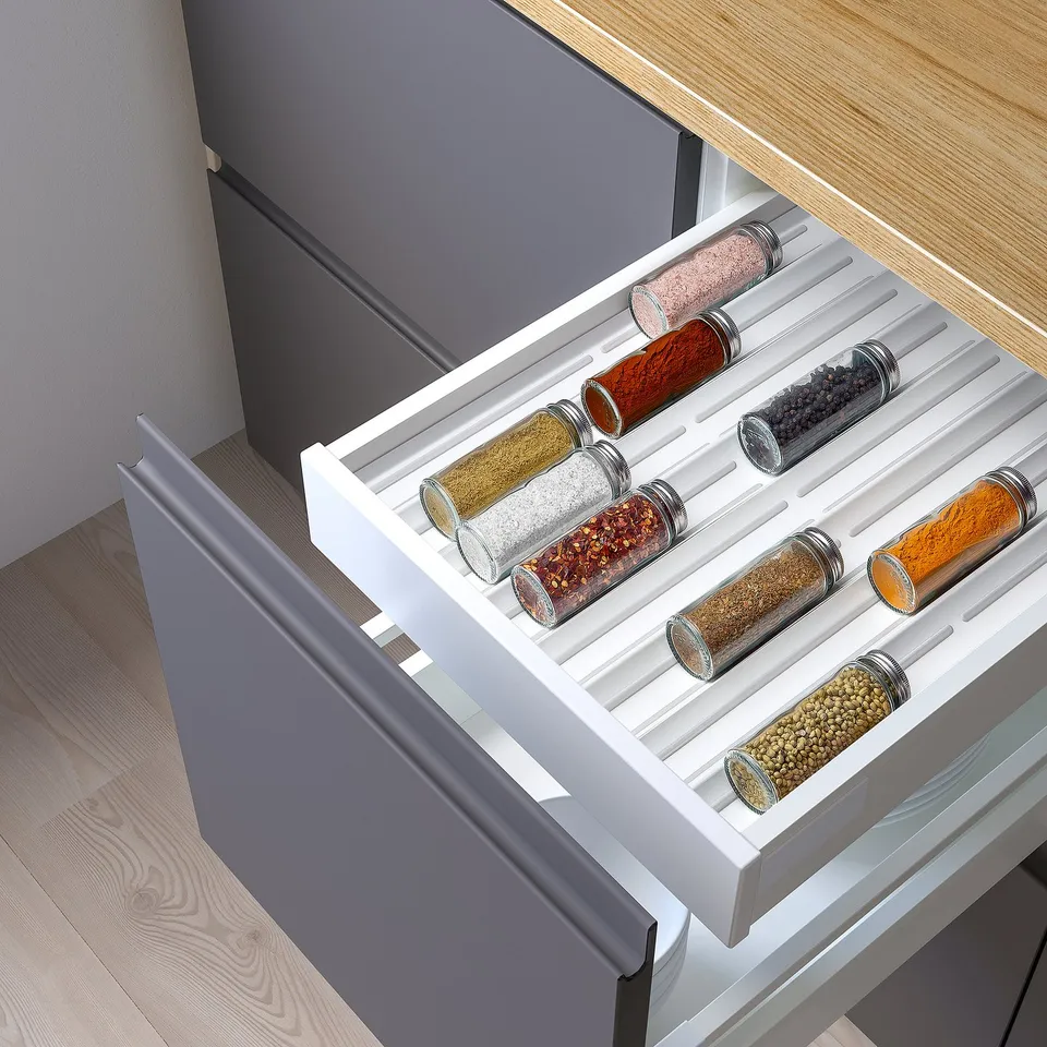 Spice drawer organiser, keeps jars in place with anti-slip material.