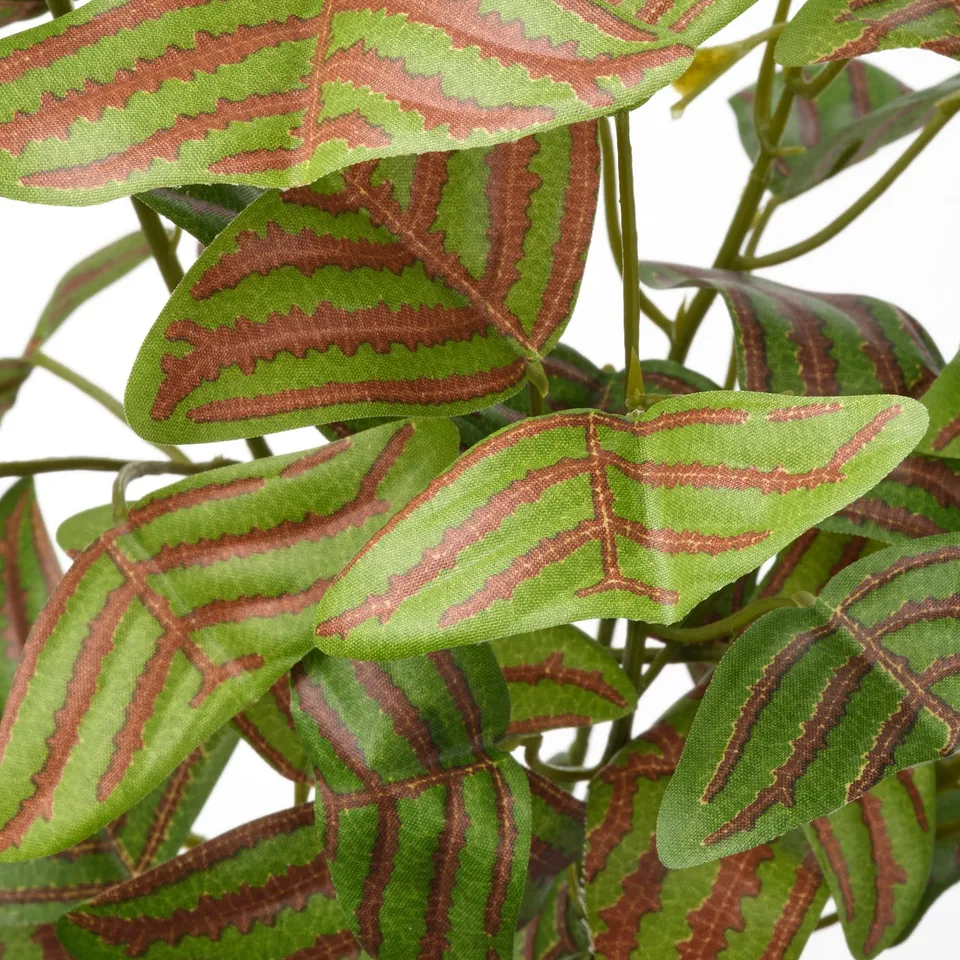 Artificial plant with vibrant green leaves, detailed brown veins, and natural-looking stems.