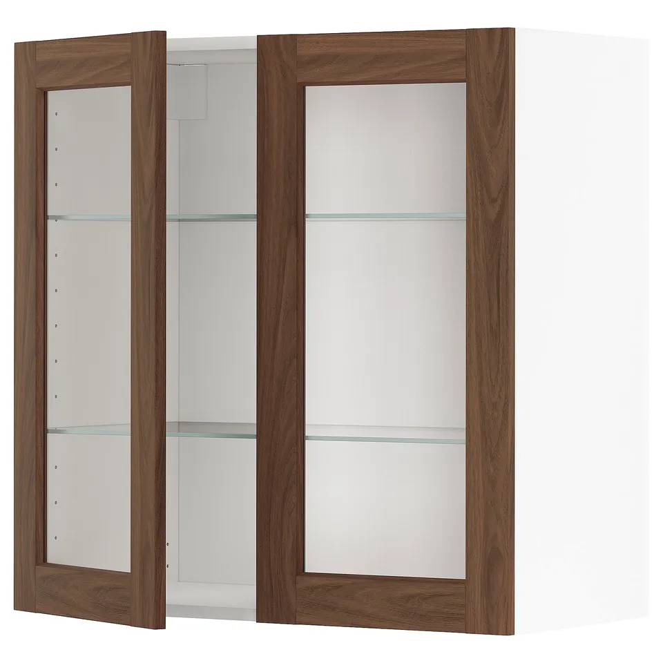 METOD kitchen unit with walnut foil doors and glass shelves.