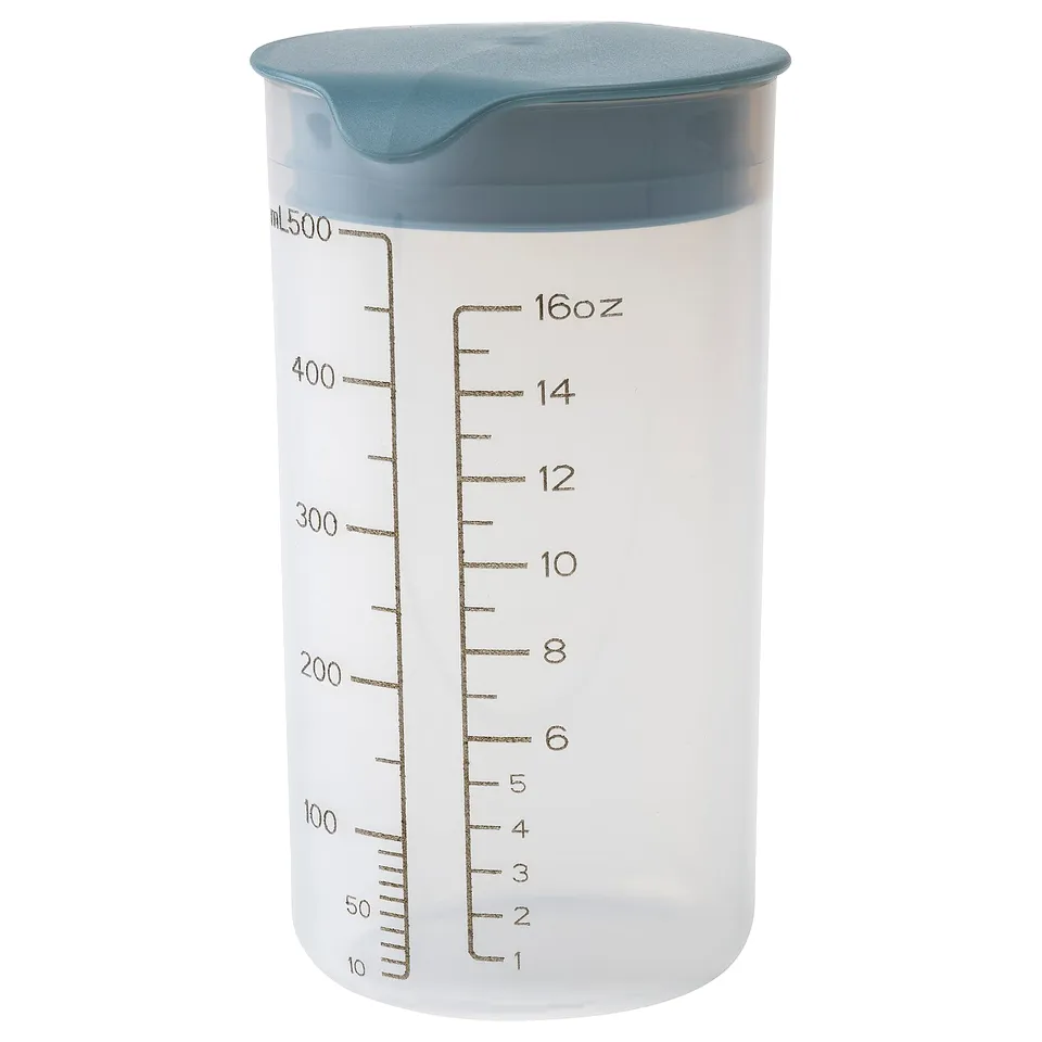 STANDARDMÅTT plastic shaker, blue lid, white body, cylindrical, graduated markings.