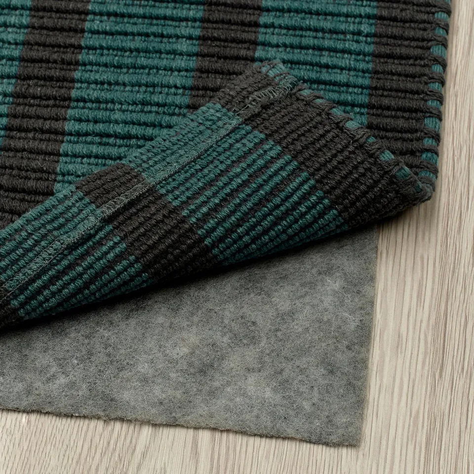 Green and black striped rug with anti-slip felt underlay, ideal for hallways, easy to clean.