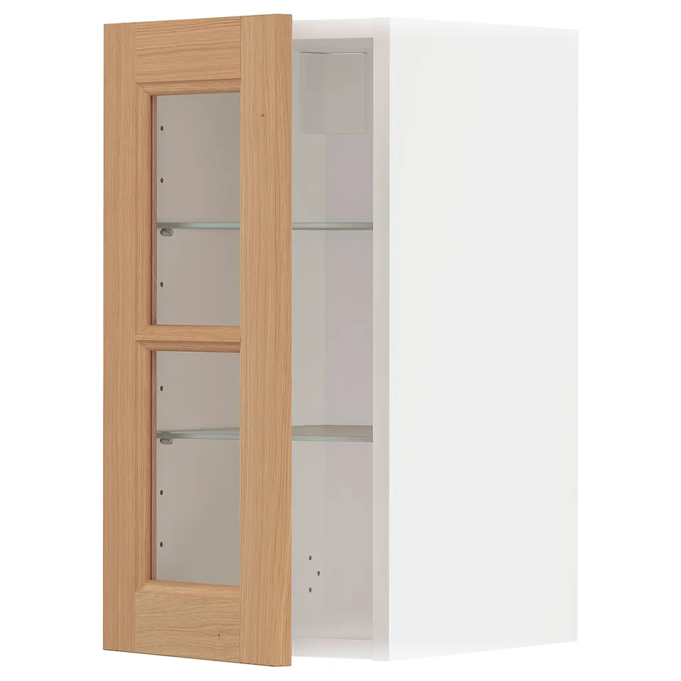 A METOD kitchen cabinet with oak doors and glass shelves. Its a wall-mounted unit with a natural wood look, perfect for a warm and inviting kitchen.