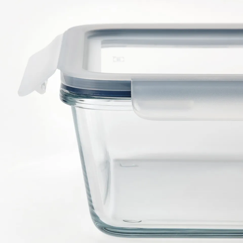 Clear glass container with snap-on plastic lid, showcasing durability and airtight seal. Ideal for food storage.