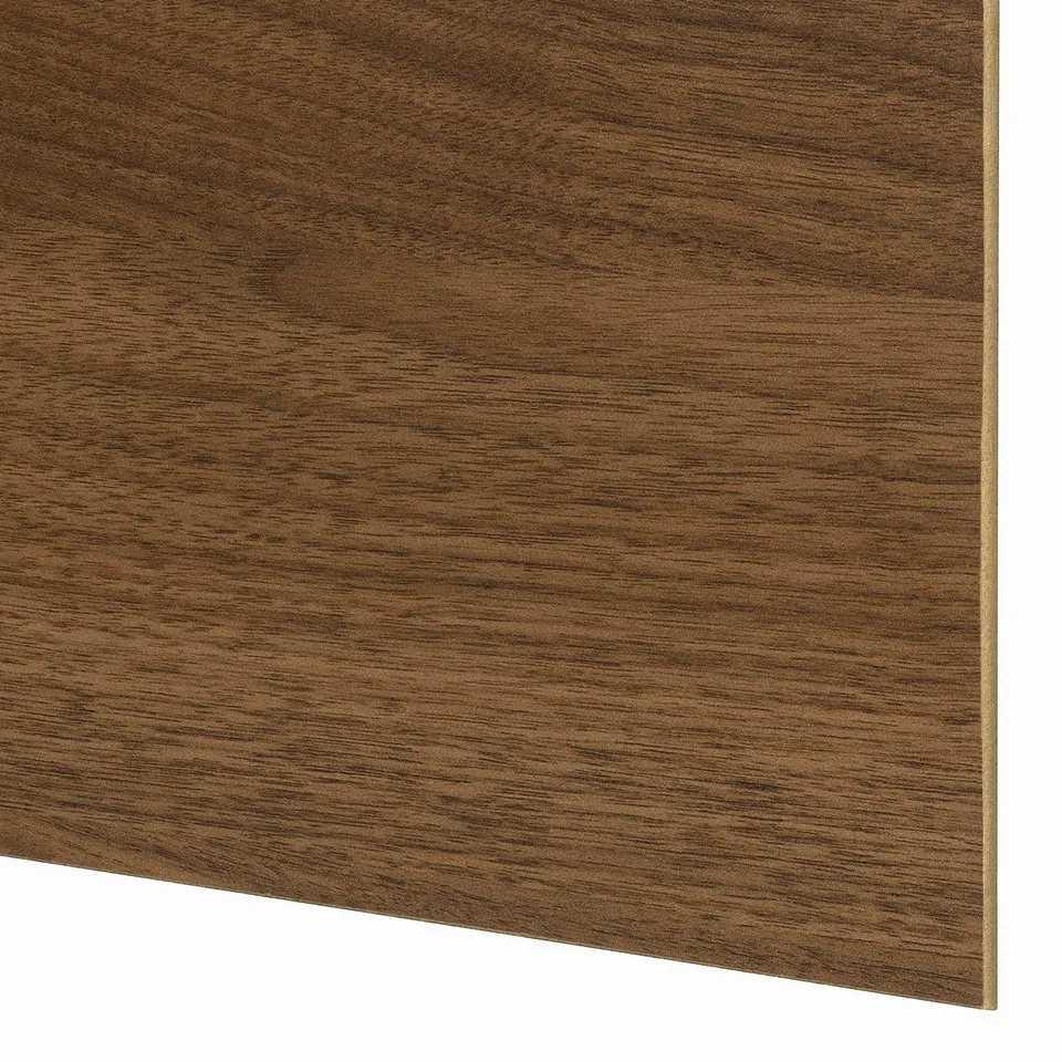 A close-up of a smooth, richly grained wooden surface, likely from the PAX wardrobe, exhibiting high-quality craftsmanship and finish.