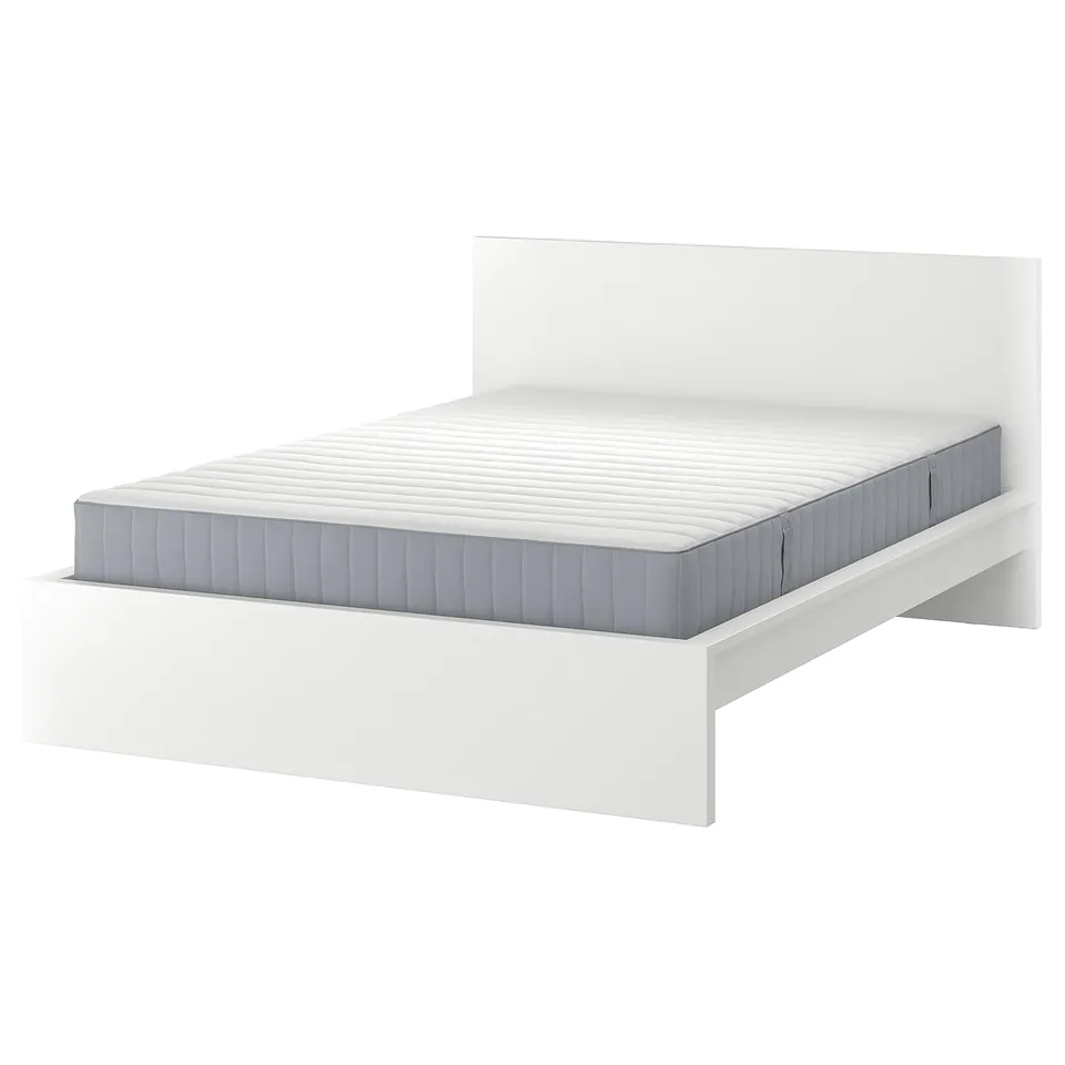 A white MALM bed with a high headboard and grey mattress. The frame is adjustable and modern.