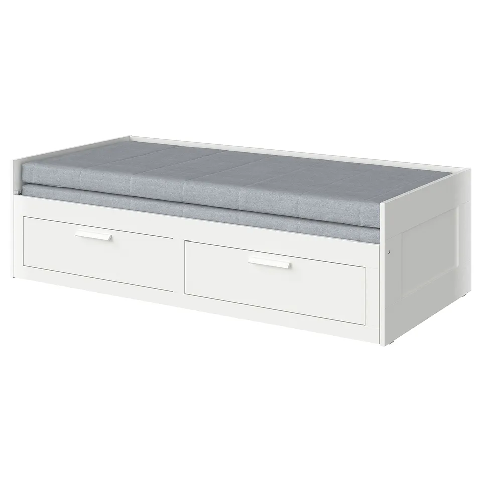 A white BRIMNES daybed with a grey cushion on top, featuring two storage drawers underneath.