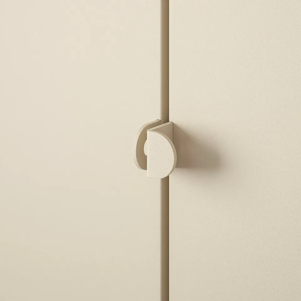 Sleek, minimalist door handle in neutral tone, mounted on smooth, matte-finished door.