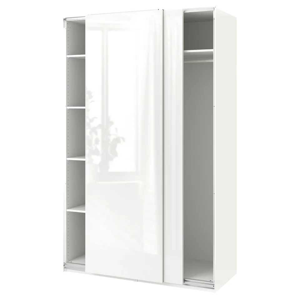 A white ikea PAX wardrobe with sliding doors and clear shelves.