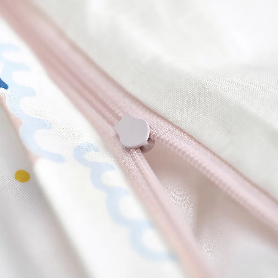Small pink zip pull with a white apple logo, suitable for childrens items.