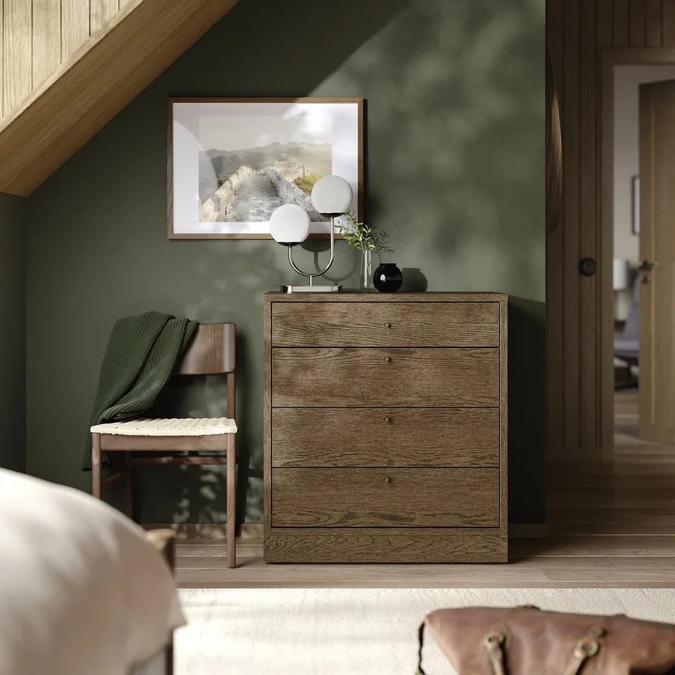 TONSTAD dresser with 4 drawers in bedroom, modern handles, against green walls, with decor.