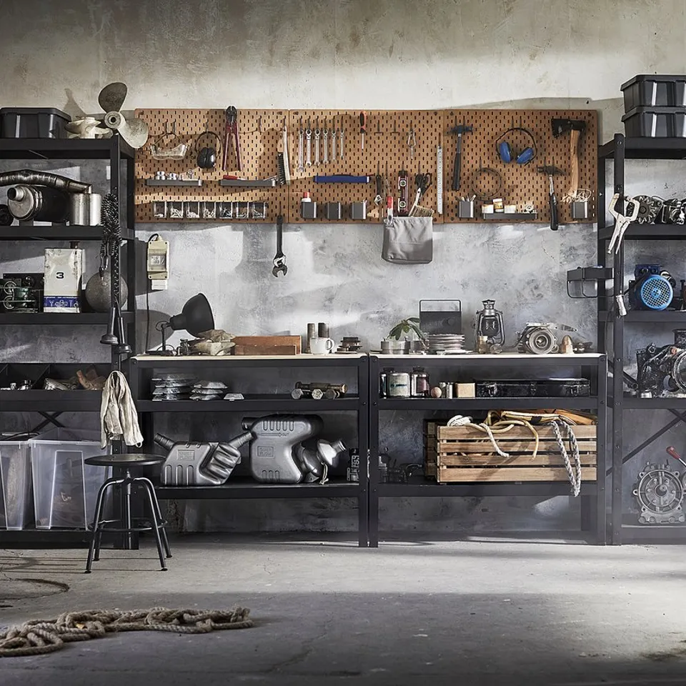 A BROR storage system in a workshop, holding tools and items.