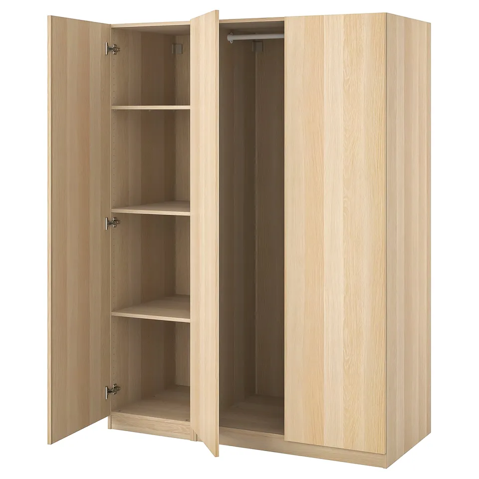 Light wood PAX wardrobe with open left side shelves and closed right side. Light, minimalist design.
