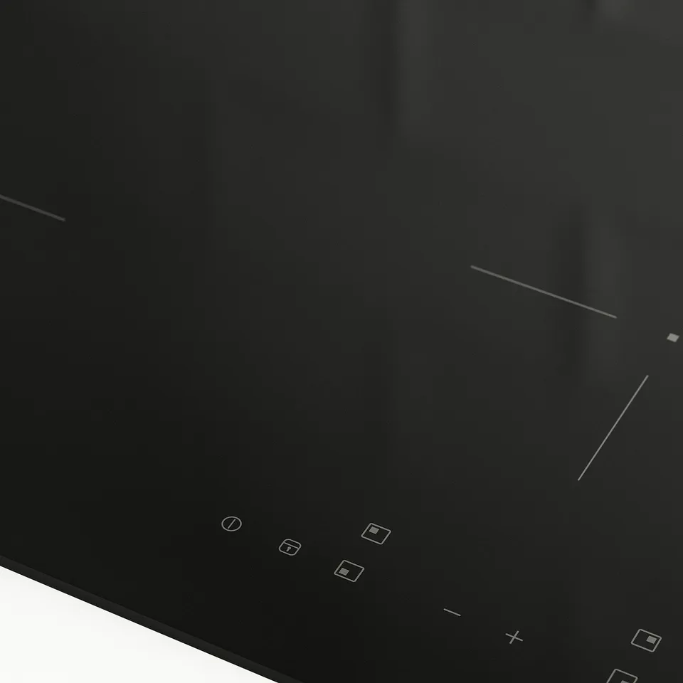 Black induction hob with touch controls, featuring four cooking zones, a lock key, and a sleek, easy-to-clean surface.