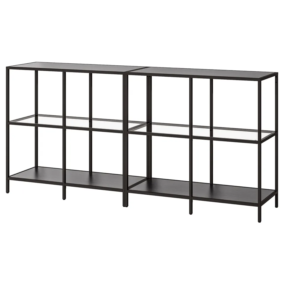 VITTSJÖ shelves. Its sleek, black, with clear glass shelves for a modern look.