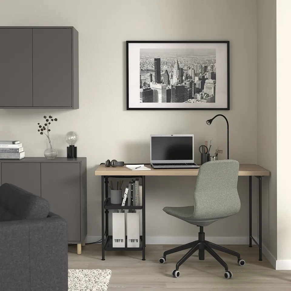Modern home office with LAGKAPTEN desk, chair, laptop, and decor.