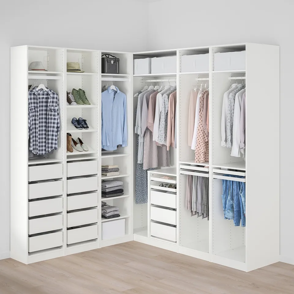 White PAX wardrobe, clean clothes organised in hangers, shelves, and drawers.
