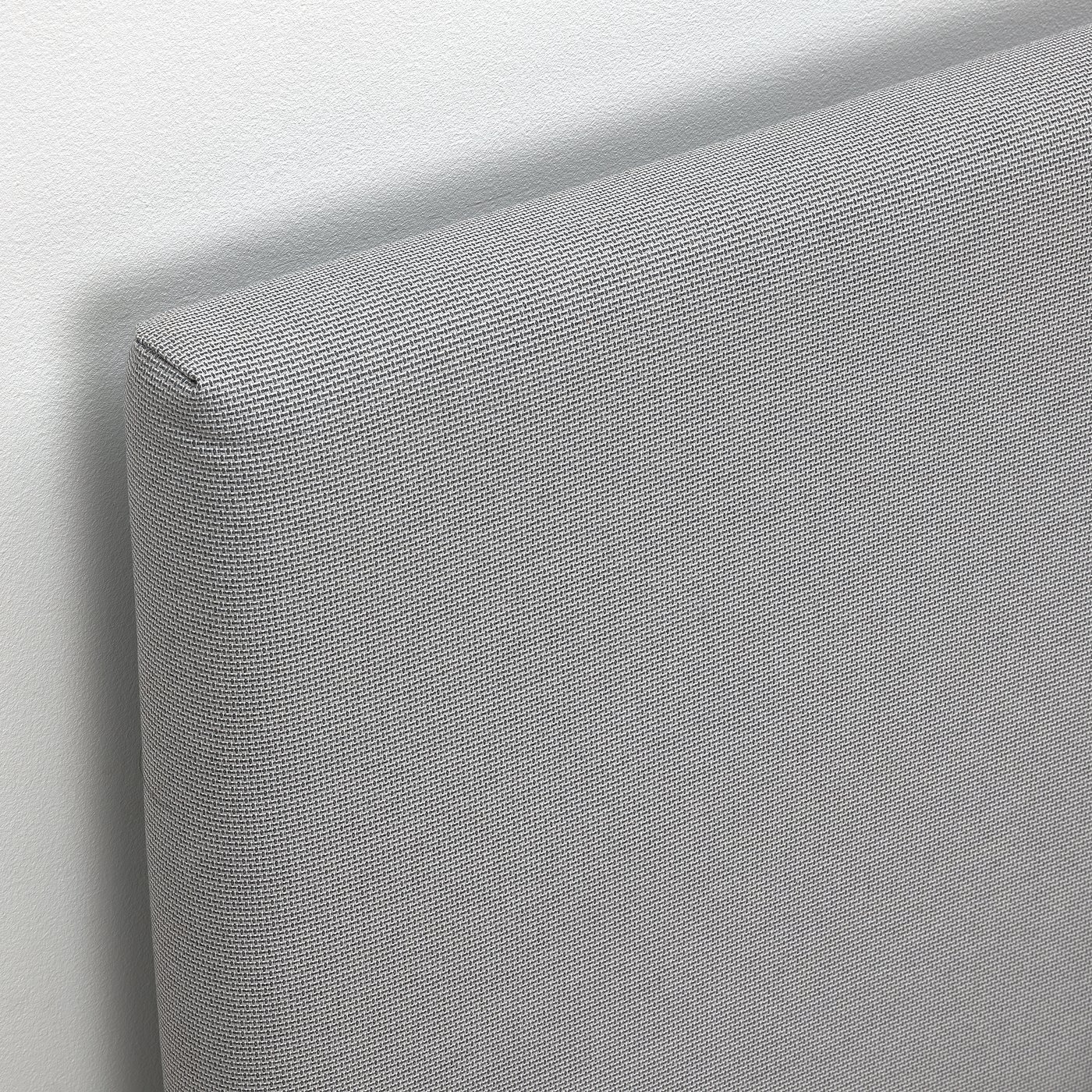 Modern upholstered bed with padded headboard. Grey fabric with subtle texture design. Clean, minimalist look.