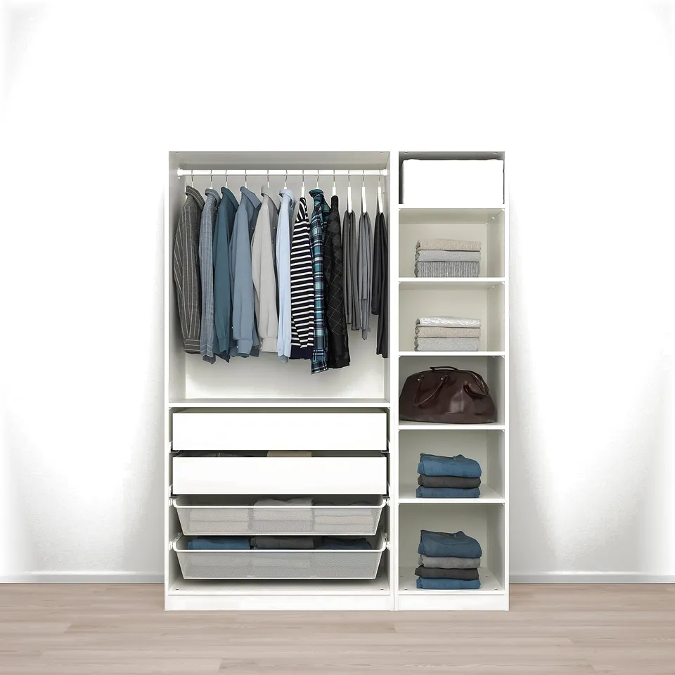 White wardrobe with hanging shirts, folded clothes, and a handbag.
