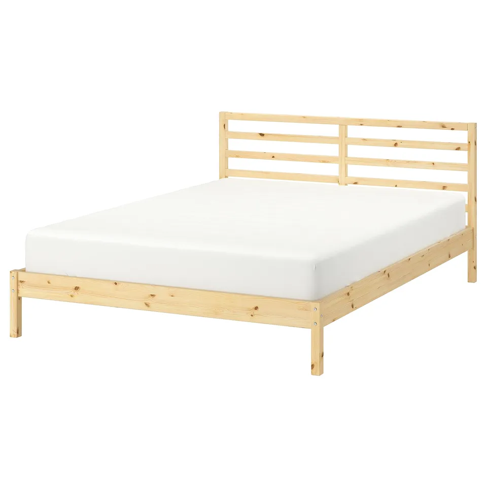 Untreated wood TARVA bed with white mattress; simple scandinavian design. Pine wood; rectangular shape with slatted headboard.