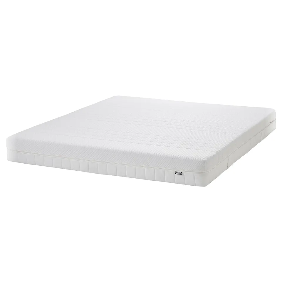 IKEA HEMNES foam mattress: white, rectangular, textured surface, with white stitching and IKEA logo.