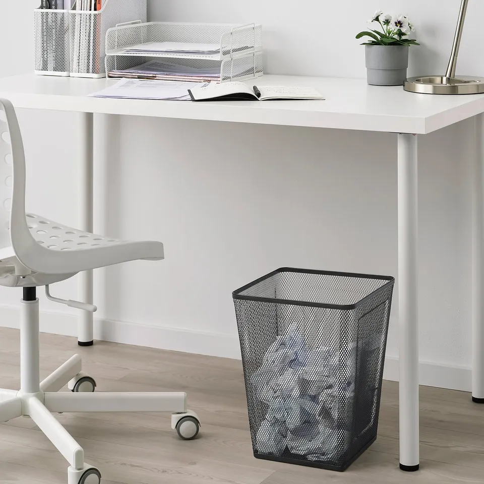 Black mesh wastepaper, small, rectangular, office, fits under desk, next to chair, plastic feet.