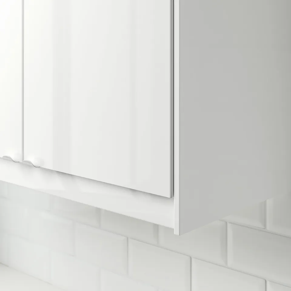 White kitchen cable cover, seamless with tiles.